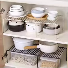 Expandable shelf raiser