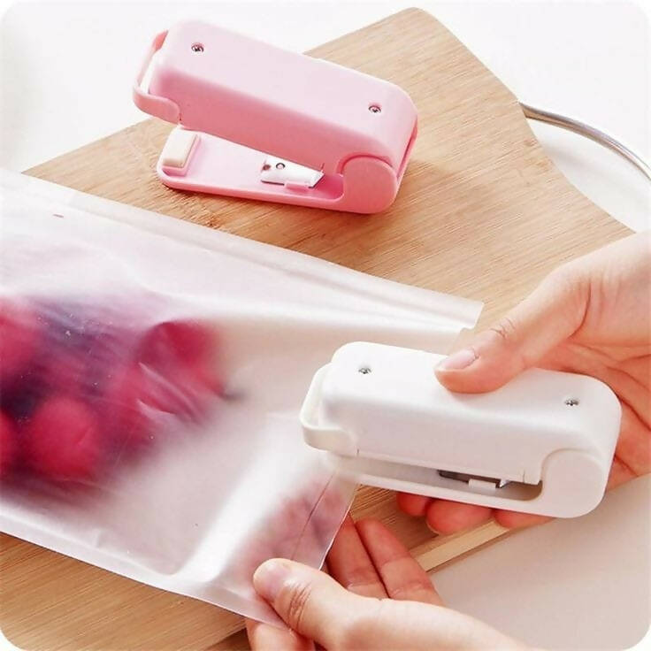 Battery powered mini sealing machine with magnetic plate