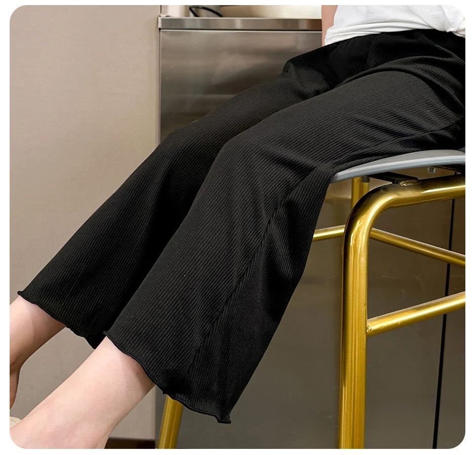 Children's solid color bell bottoms girls summer color casual fashion pants female students elastic waist pants with wavy sides.