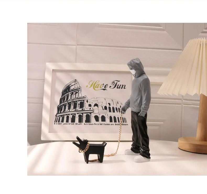 Banksy a trendy man playing with dogs, white fashion toys, art sculptures and ornaments