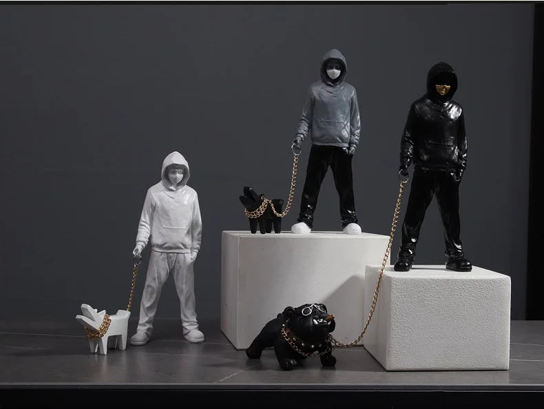 Banksy a trendy man playing with dogs, white fashion toys, art sculptures and ornaments