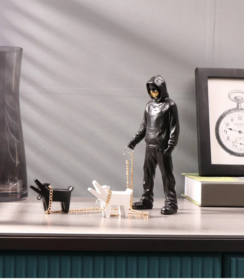 Banksy a trendy man playing with dogs, white fashion toys, art sculptures and ornaments