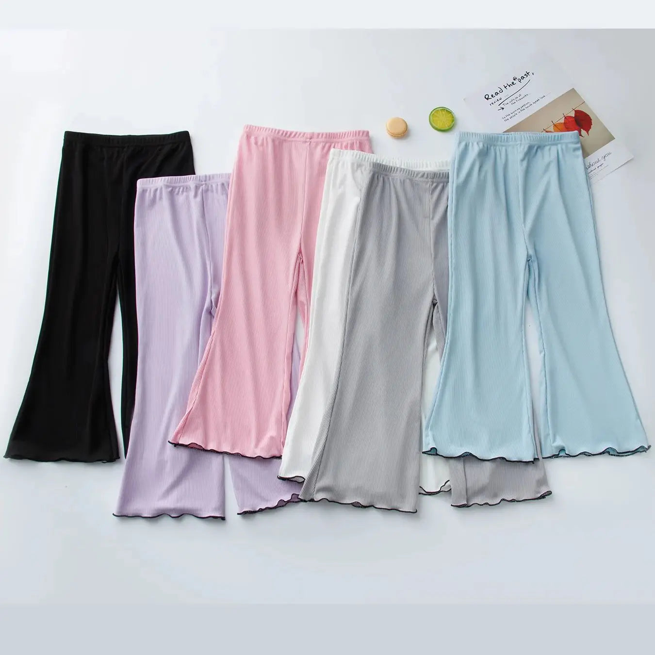 Children's solid color bell bottoms girls summer color casual fashion pants female students elastic waist pants with wavy sides.