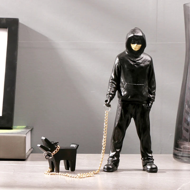 Banksy a trendy man playing with dogs, white fashion toys, art sculptures and ornaments