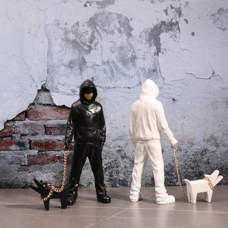 Banksy a trendy man playing with dogs, white fashion toys, art sculptures and ornaments