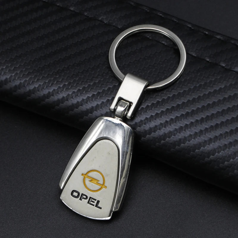 1Pcs Metal/Leather Car Keychain Badge Emblem For Opel Astra GTC Insignia Antara Meriva Zafira Key Chain Rings Auto Accessories