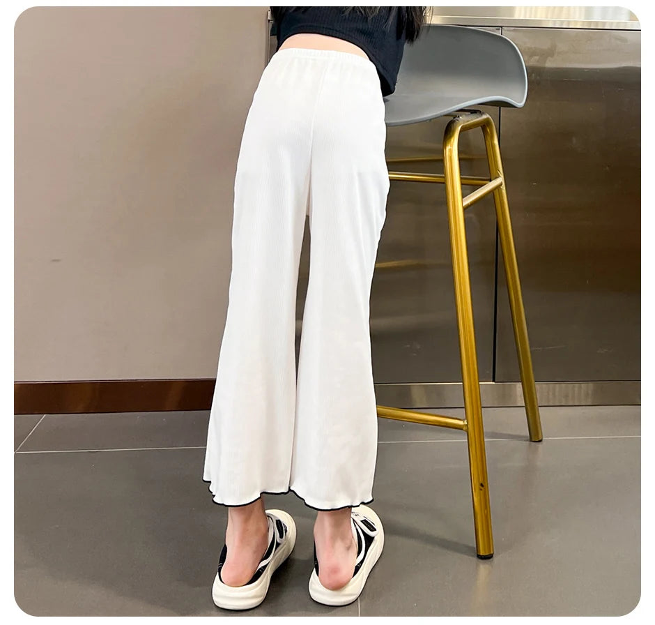 Children's solid color bell bottoms girls summer color casual fashion pants female students elastic waist pants with wavy sides.