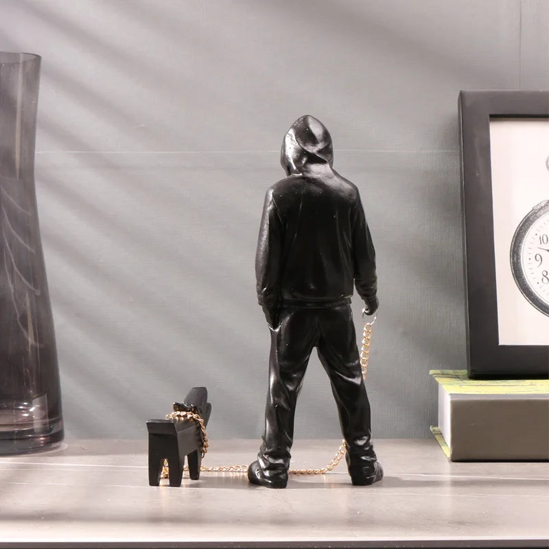 Banksy a trendy man playing with dogs, white fashion toys, art sculptures and ornaments