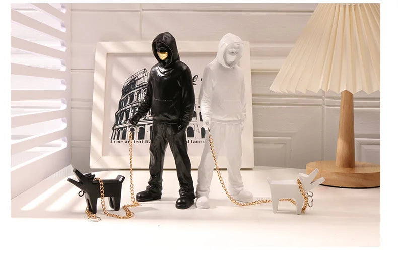 Banksy a trendy man playing with dogs, white fashion toys, art sculptures and ornaments