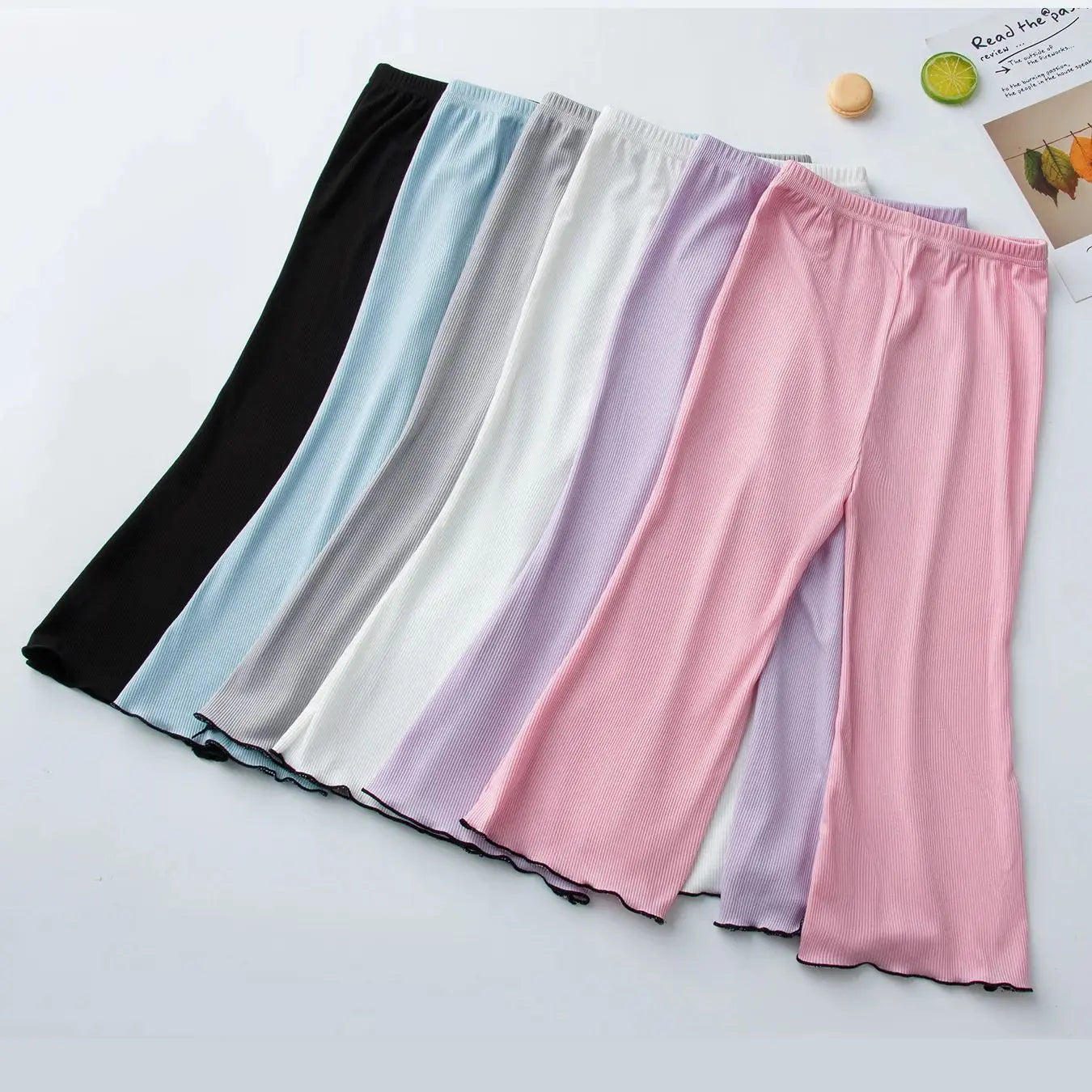 Children's solid color bell bottoms girls summer color casual fashion pants female students elastic waist pants with wavy sides.