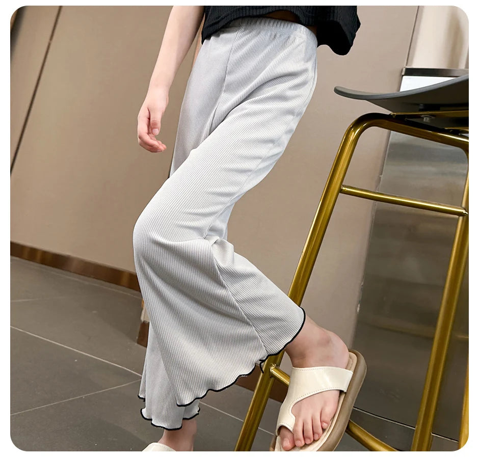 Children's solid color bell bottoms girls summer color casual fashion pants female students elastic waist pants with wavy sides.