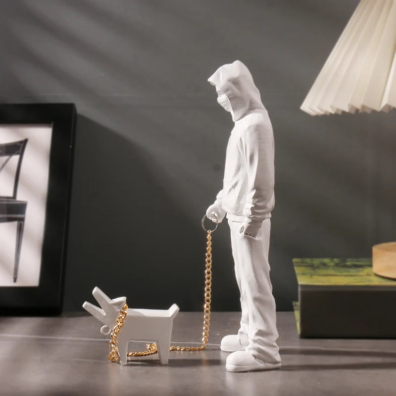 Banksy a trendy man playing with dogs, white fashion toys, art sculptures and ornaments