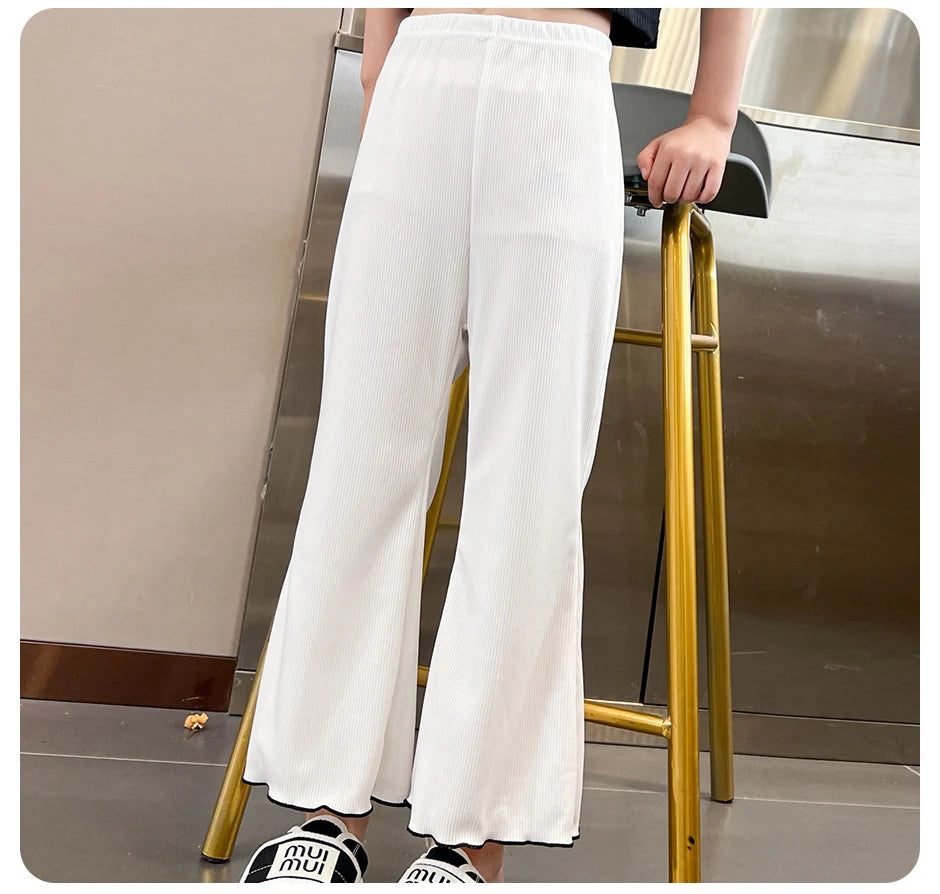 Children's solid color bell bottoms girls summer color casual fashion pants female students elastic waist pants with wavy sides.