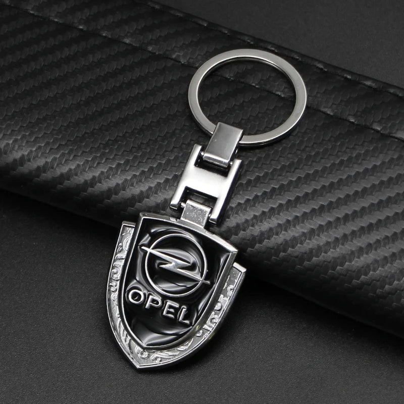 1Pcs Metal/Leather Car Keychain Badge Emblem For Opel Astra GTC Insignia Antara Meriva Zafira Key Chain Rings Auto Accessories