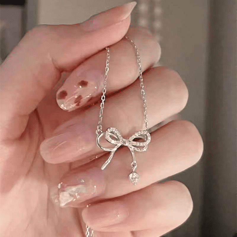 Elegant Silver Bowknot Pendant Necklace for Women - Fashionable Alloy Jewelry